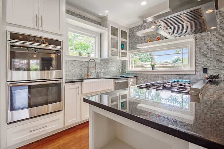 An image of a modern kitchen with sleek appliances, featuring a gas stove, refrigerator, and built-in microwave in Park Ridge